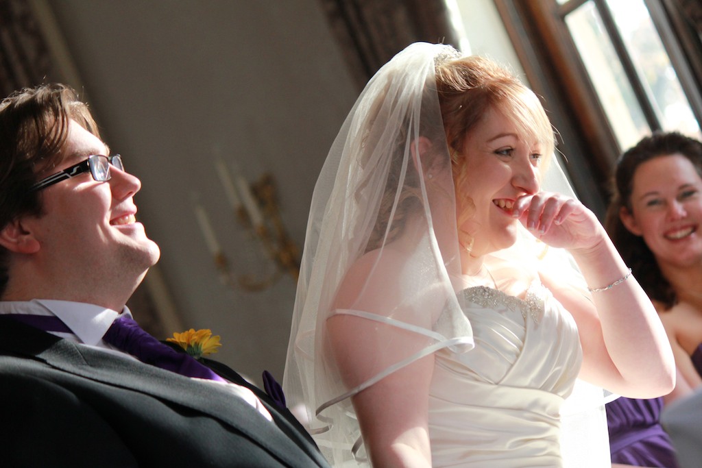 Couple laughing during their wedding ceremony