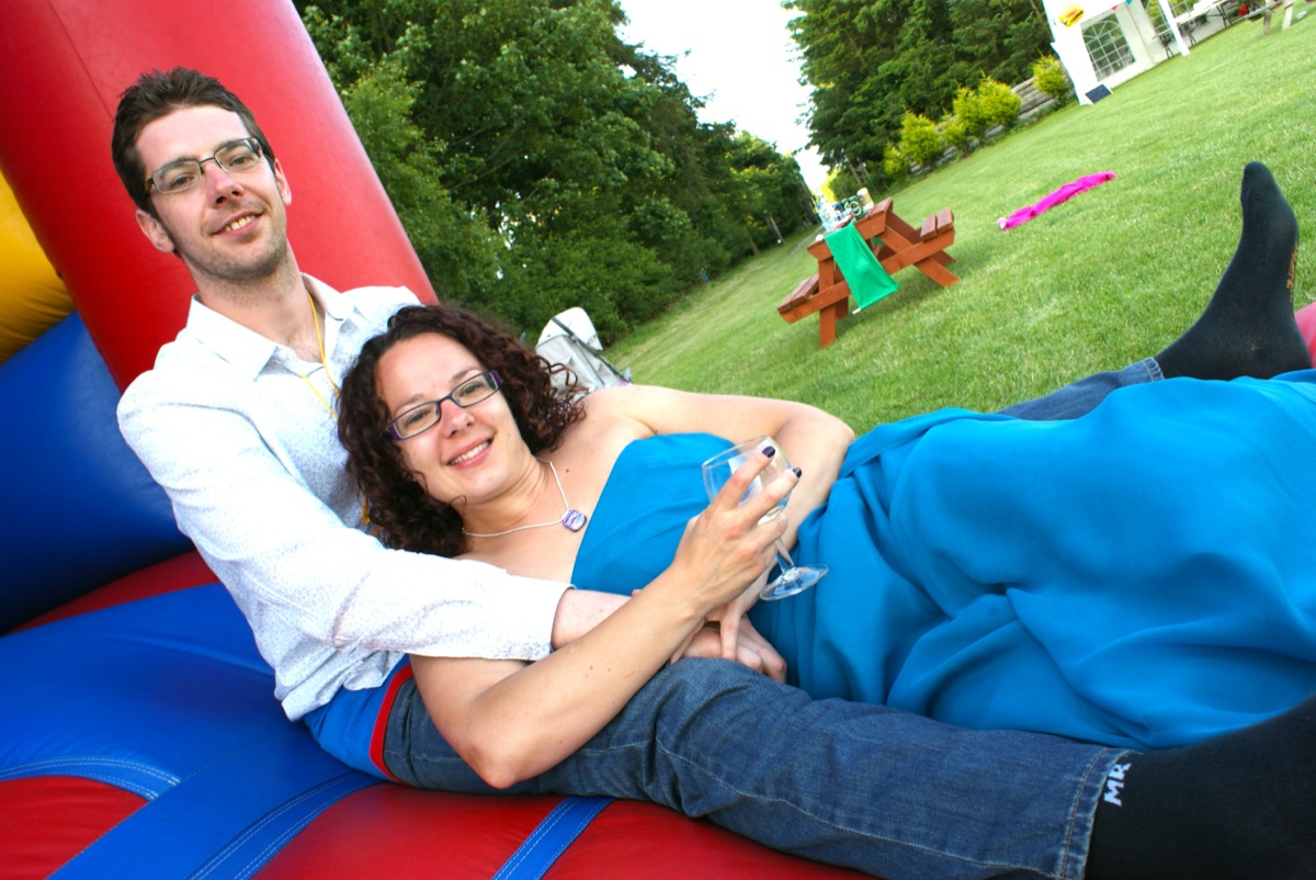 Clare and Matt relax on a bouncy castle