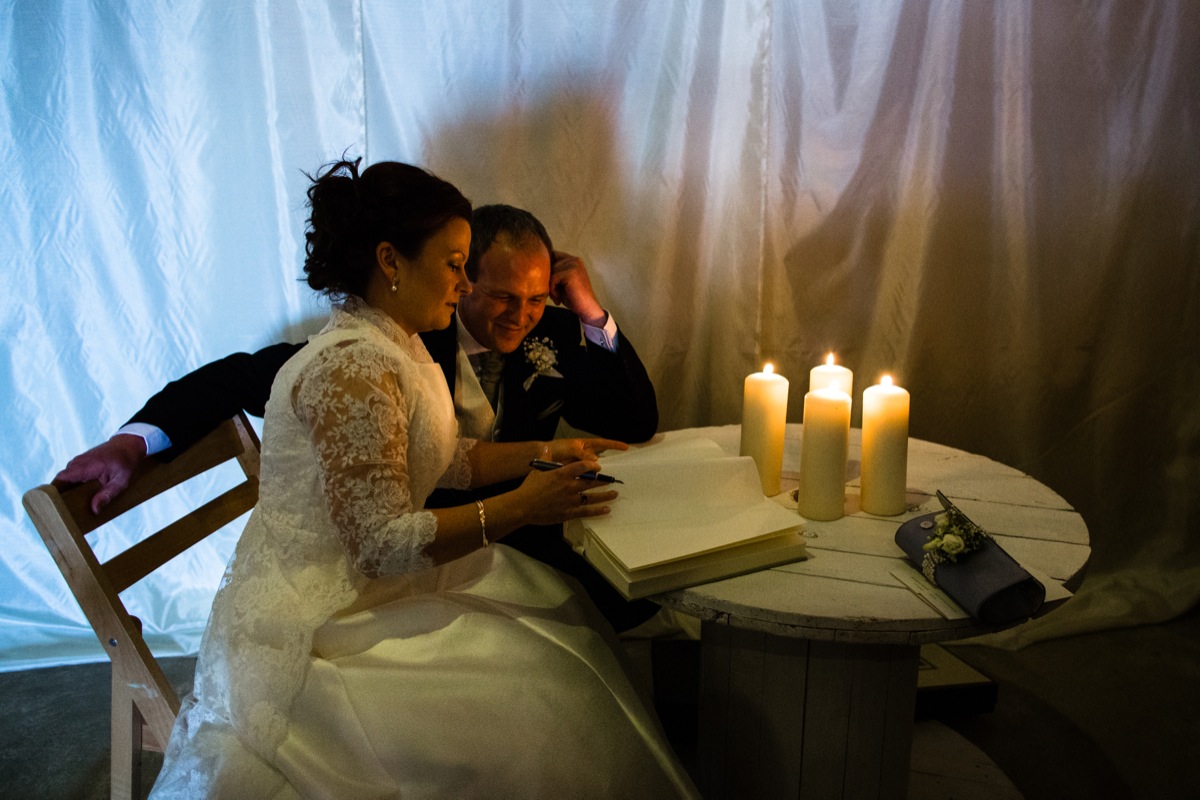 David and Kate signing a book