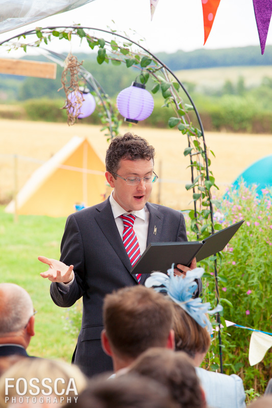 Ewan reads to the guests from a book