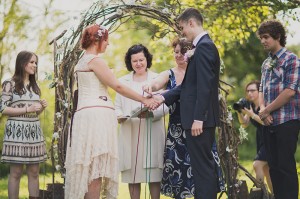 Emmy and Chris handfasting at their summer wedding