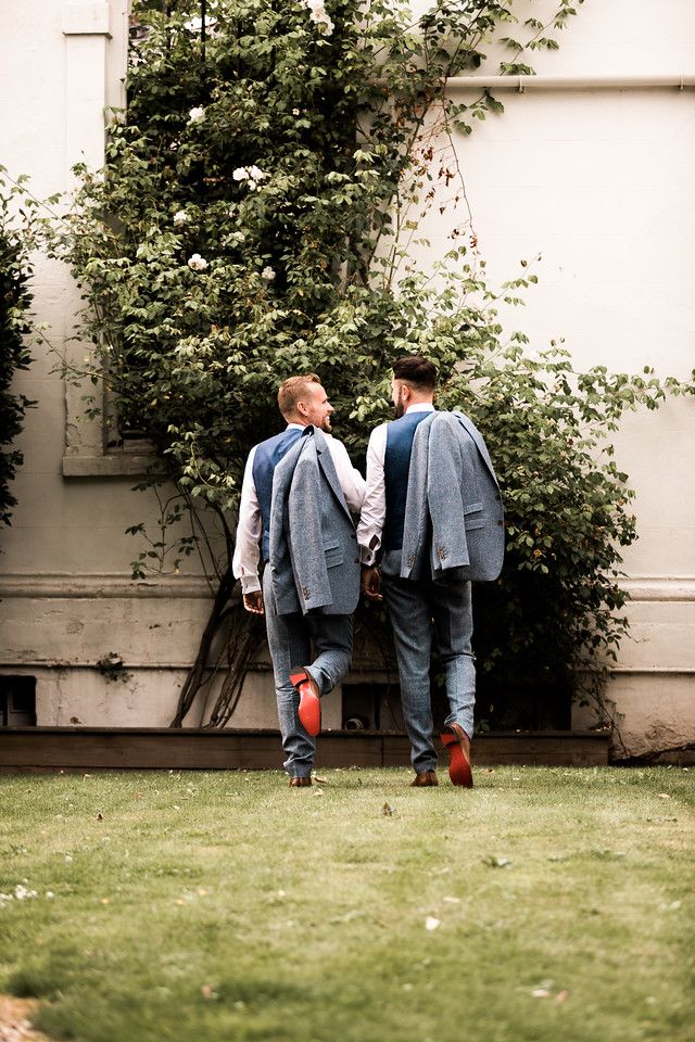 Image of two grooms walking away from camera