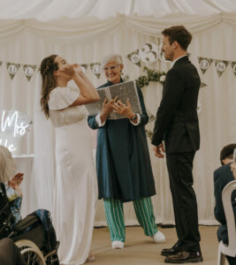 celebrant taking ceremony with bride and groom